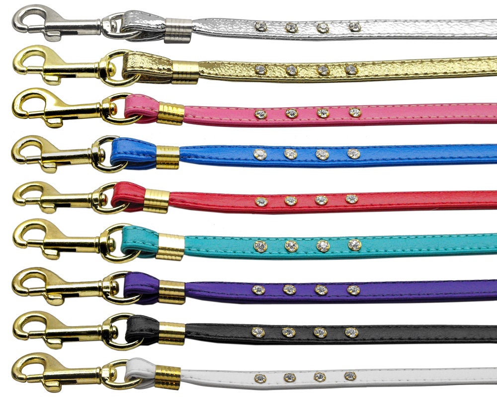 A stylish dog leash featuring clear crystal rhinestones with gold and silver hardware options, perfect for pets.