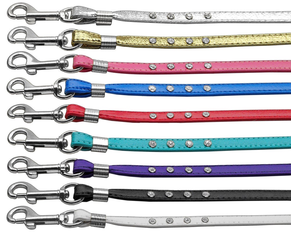 A stylish dog leash featuring clear crystal rhinestones with gold and silver hardware options, perfect for pets.