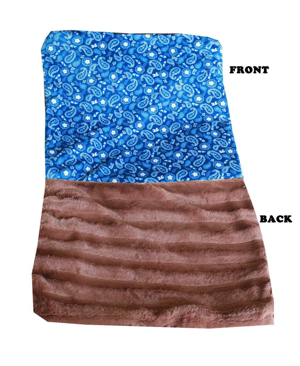 A cozy Dog, Puppy & Cat Sleepytime Cuddle Blanket in vibrant Red and Blue colors, made from soft minky faux fur, perfect for cuddling.