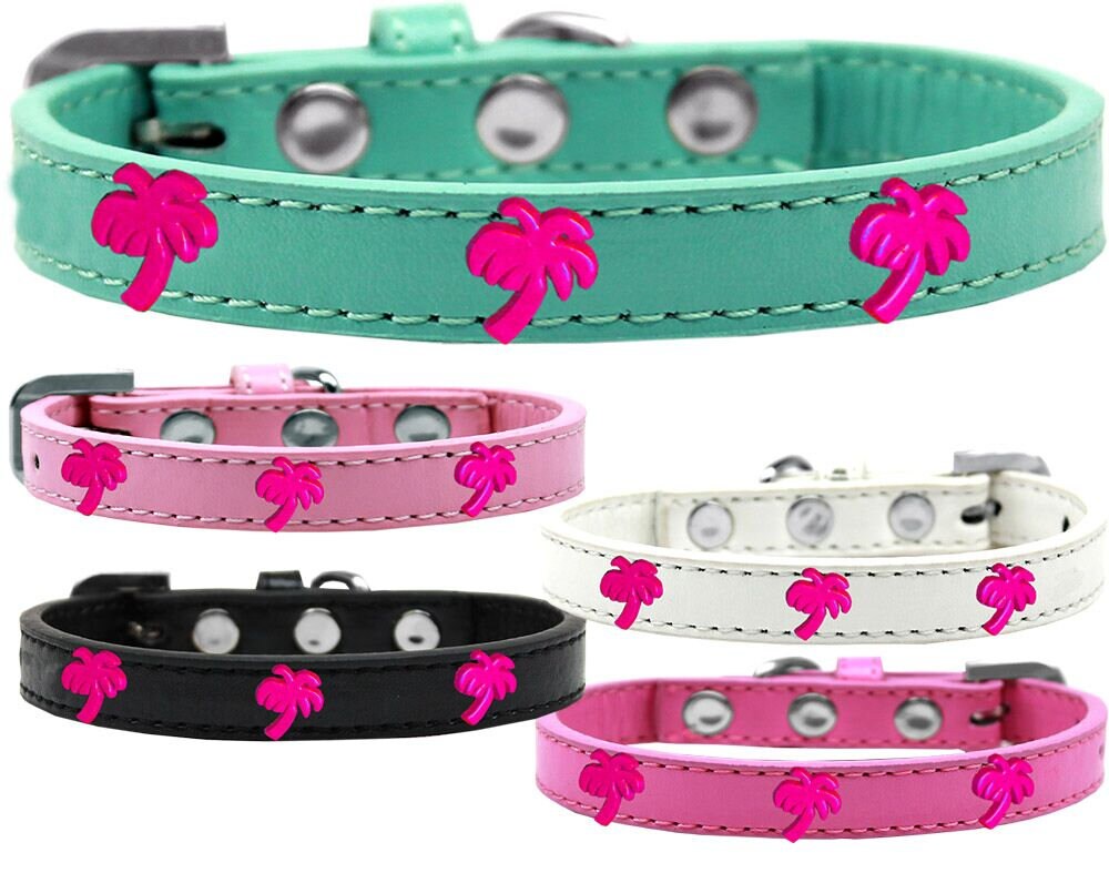 A stylish pink dog collar featuring palm tree designs and secure metal widgets, perfect for fashionable pets.