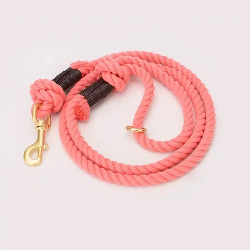 Coral Pink Dog Rope Leash made from hand woven cotton with brass hardware, showcasing its vibrant color and sturdy design.