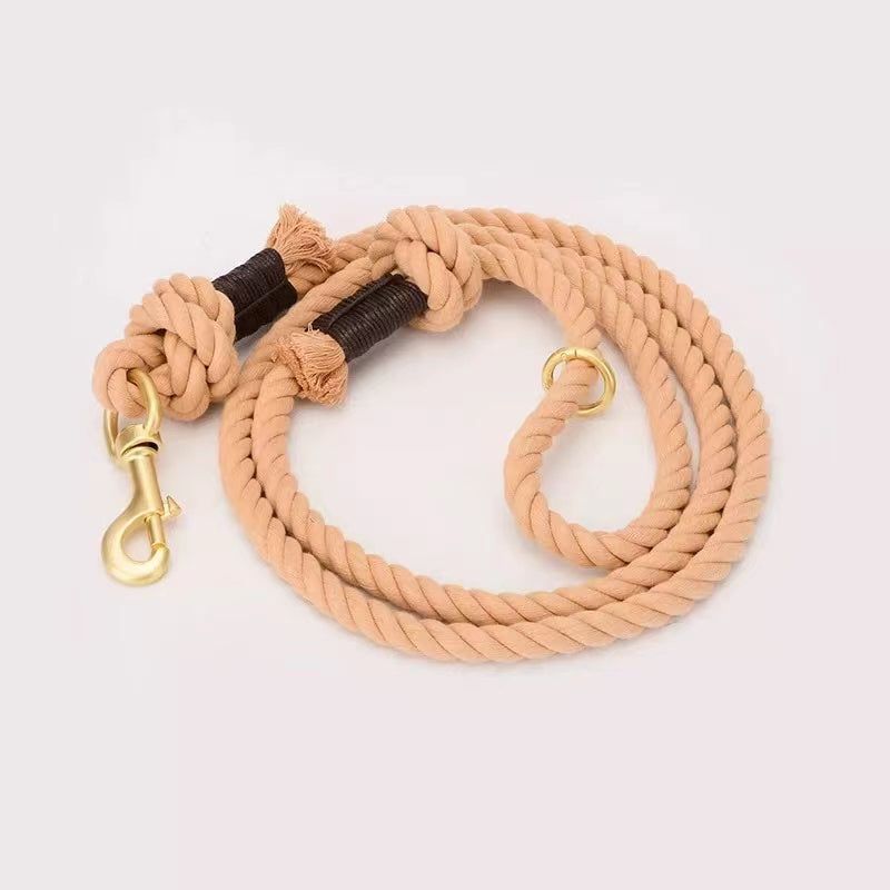 A vibrant Cotton Coral Dog Rope Leash made from hand-woven cotton, featuring solid brass hardware and a stylish design.