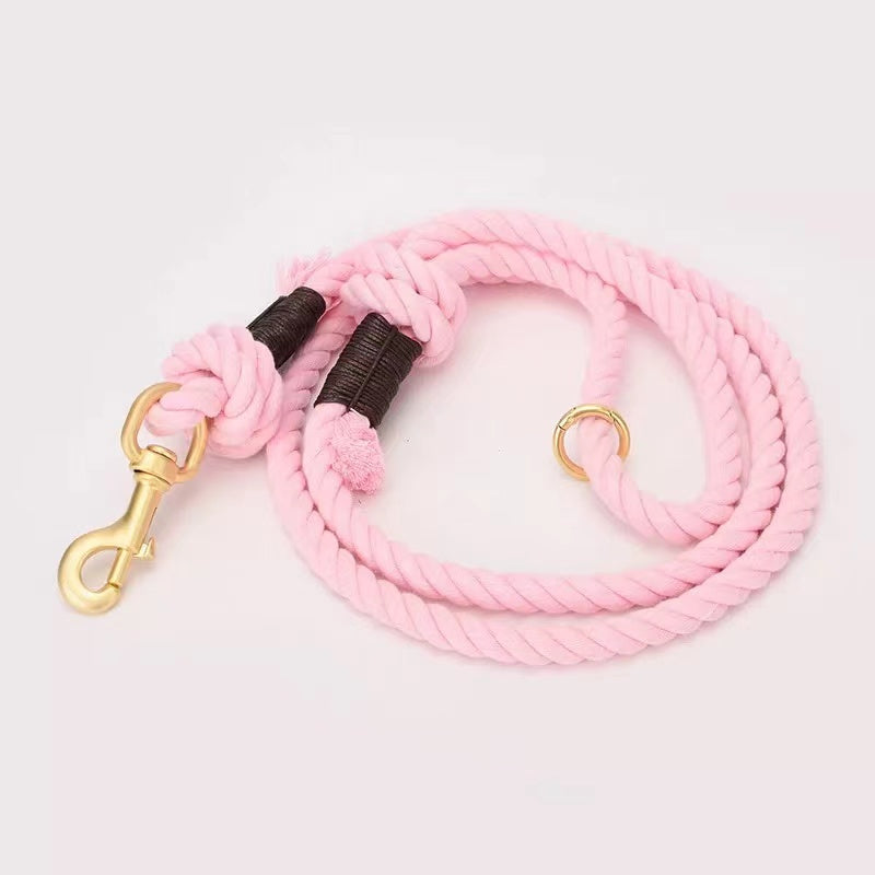 Donut Pink Dog Rope Leash made from hand woven cotton with solid brass hardware, showcasing its vibrant color and sturdy design.