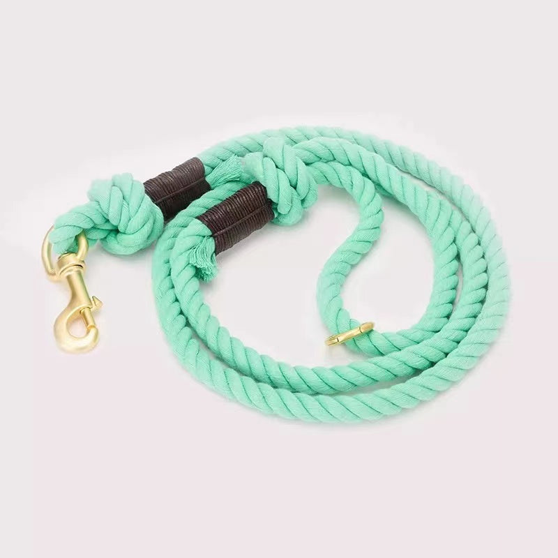 Teal Dog Rope Leash made from hand woven cotton with brass hardware, showcasing its durability and style.