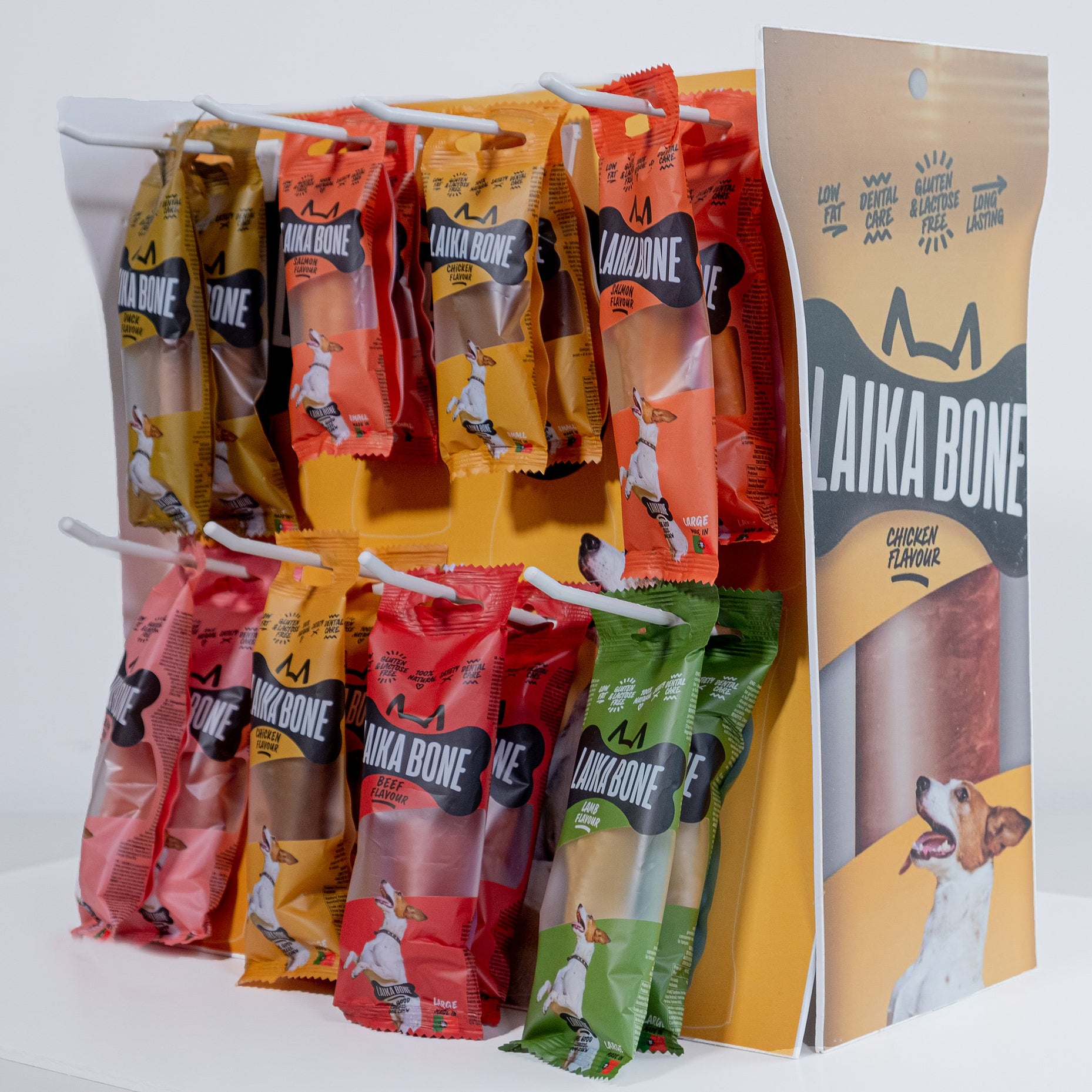 A box of LAIKA BONE Dog Treats featuring Cheese & Lamb chews, showcasing their natural ingredients and appealing texture.