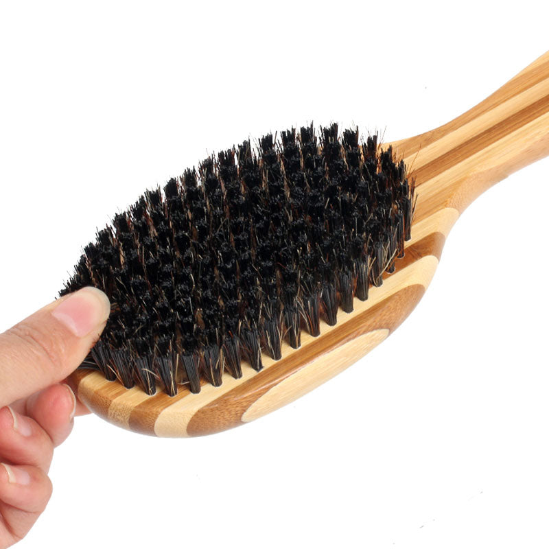 Double sided bamboo dog brush featuring silicone massager and boar bristles, ideal for grooming all dog breeds.