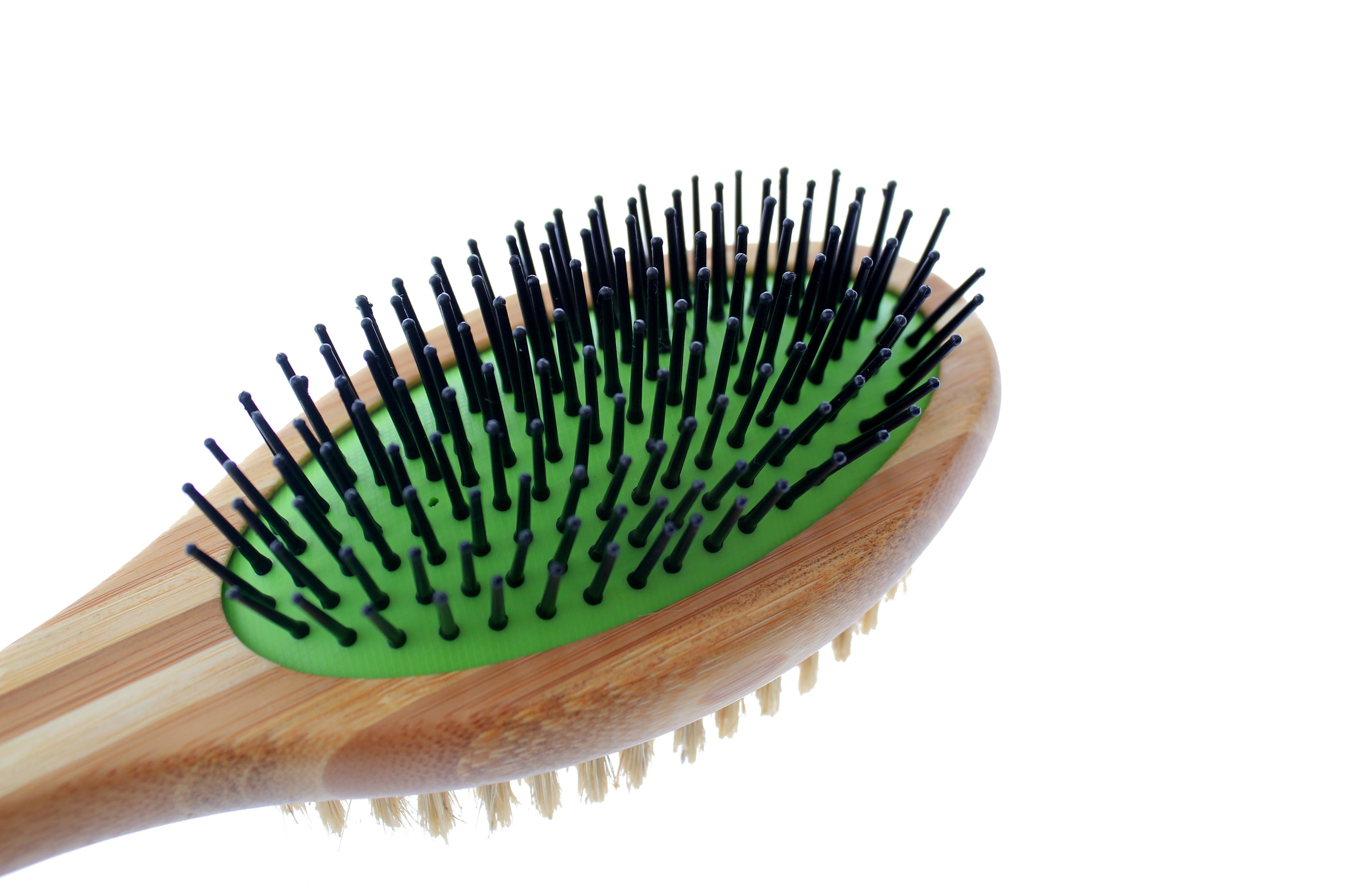 Double sided bamboo dog brush featuring pin and bristle sides for effective grooming.