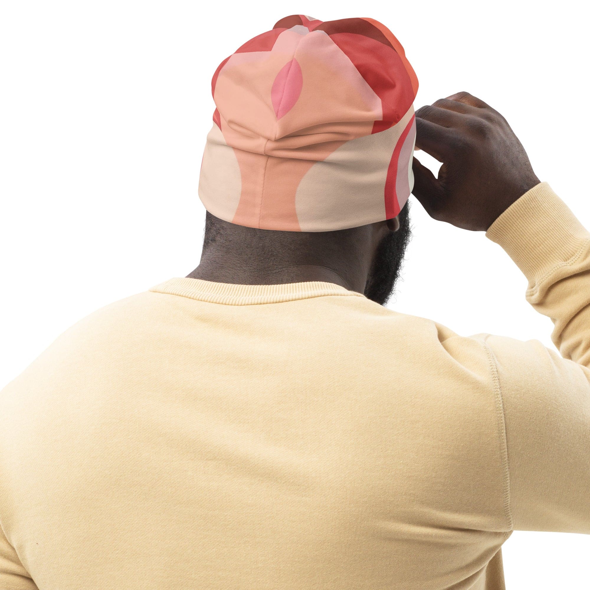 Double-layered beanie hat in pink and white with boho swirl lines pattern, showcasing its stylish and contemporary design.