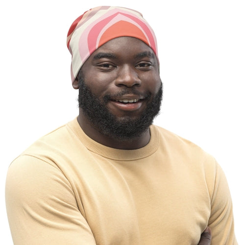 Double-layered beanie hat in pink and white with boho swirl lines pattern, showcasing its stylish and contemporary design.