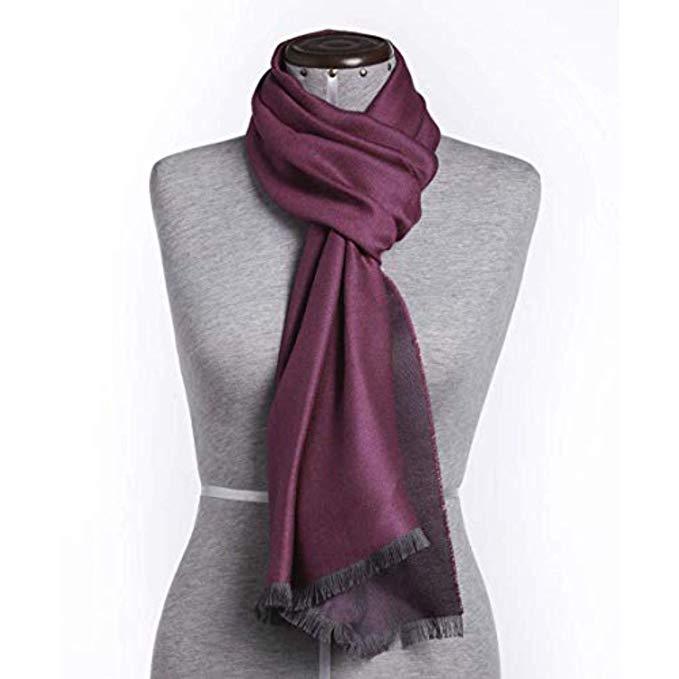 Elegant fuchsia shawl made of 70% baby alpaca and 30% silk, showcasing luxurious texture and vibrant color.