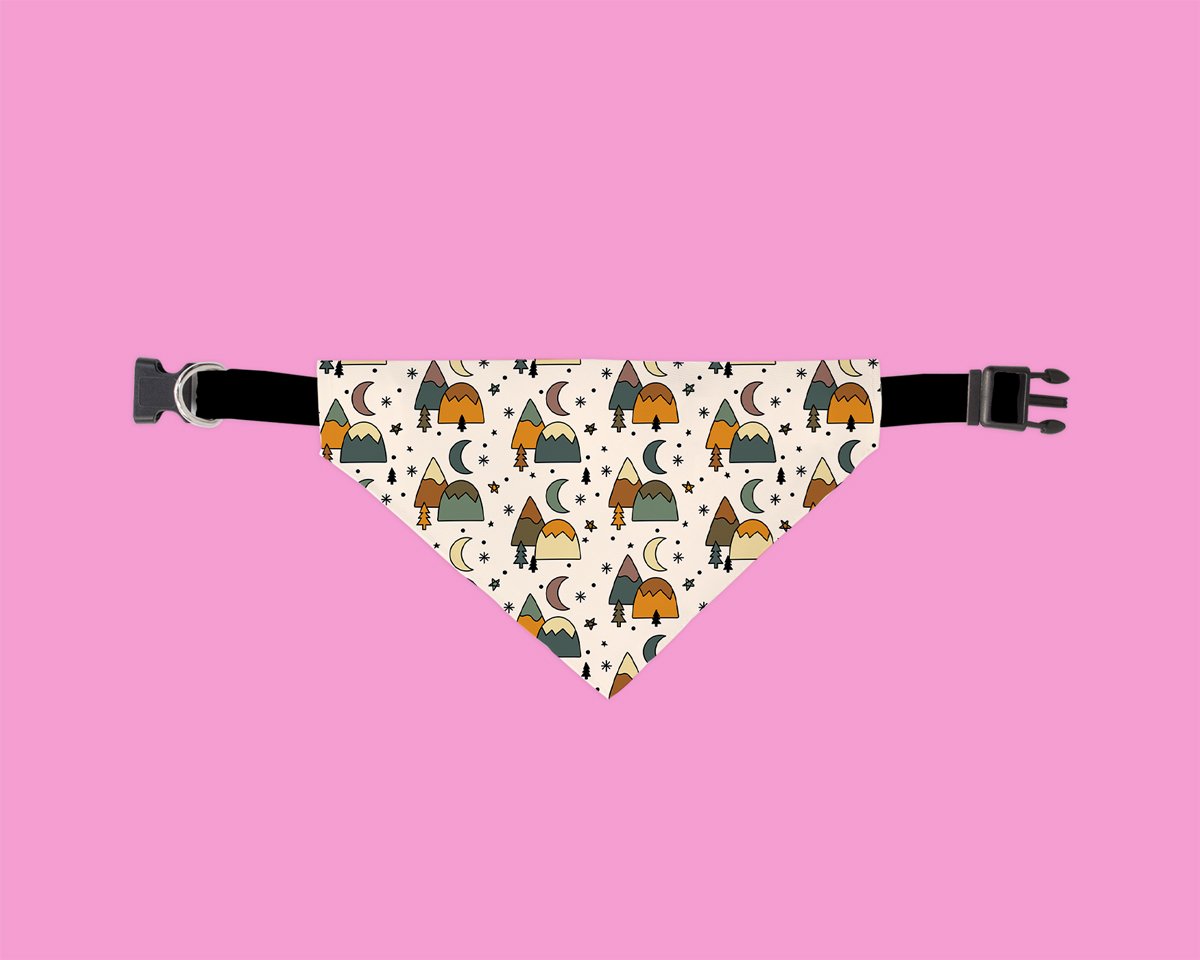 A colorful Explore More Bandana designed for dogs, featuring soft polyester fabric and a slip-on design for easy wear.