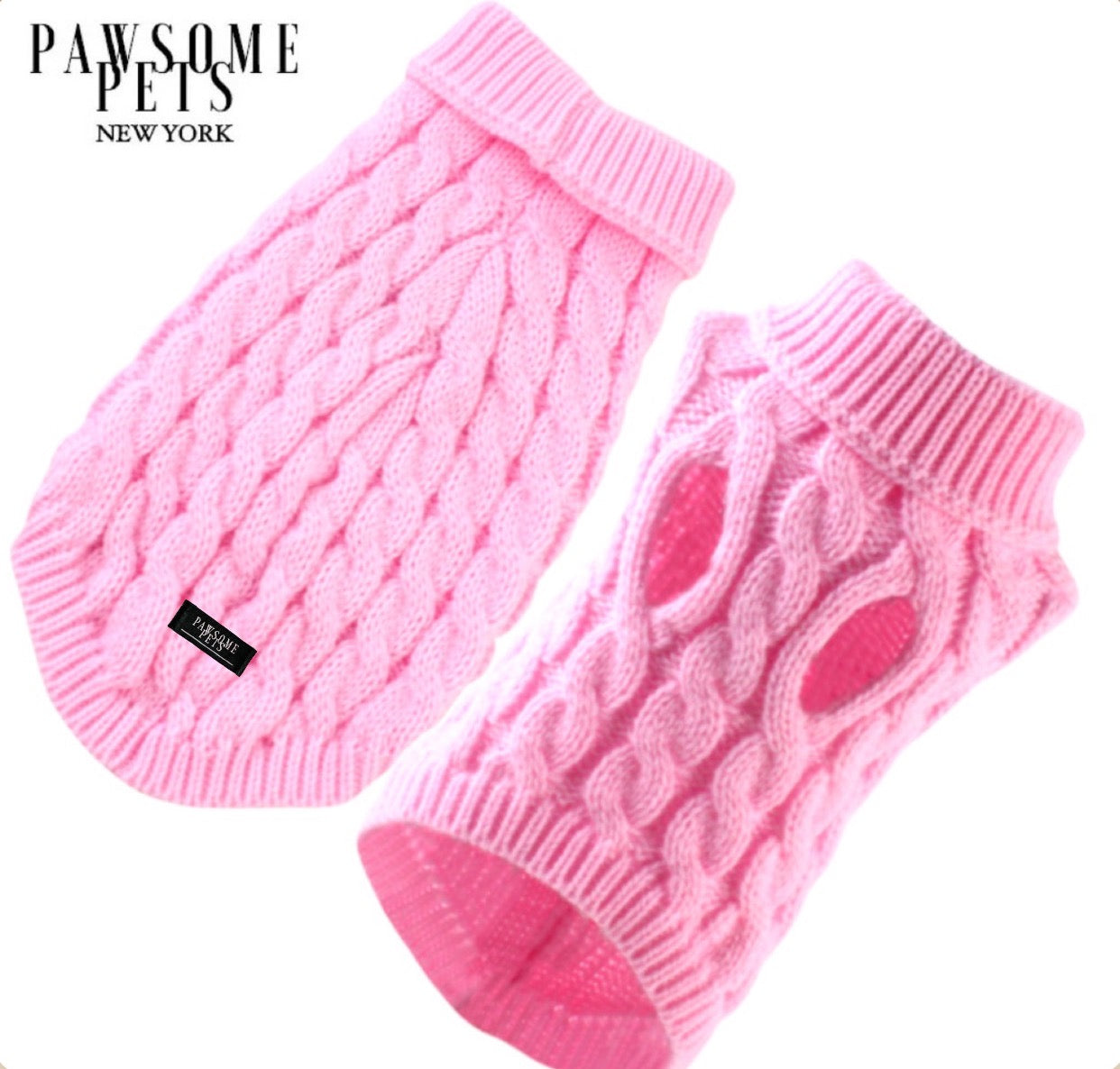 A pink cable knit sweater for dogs and cats, featuring a turtleneck design, soft texture, and stretchy fit, perfect for cold weather.