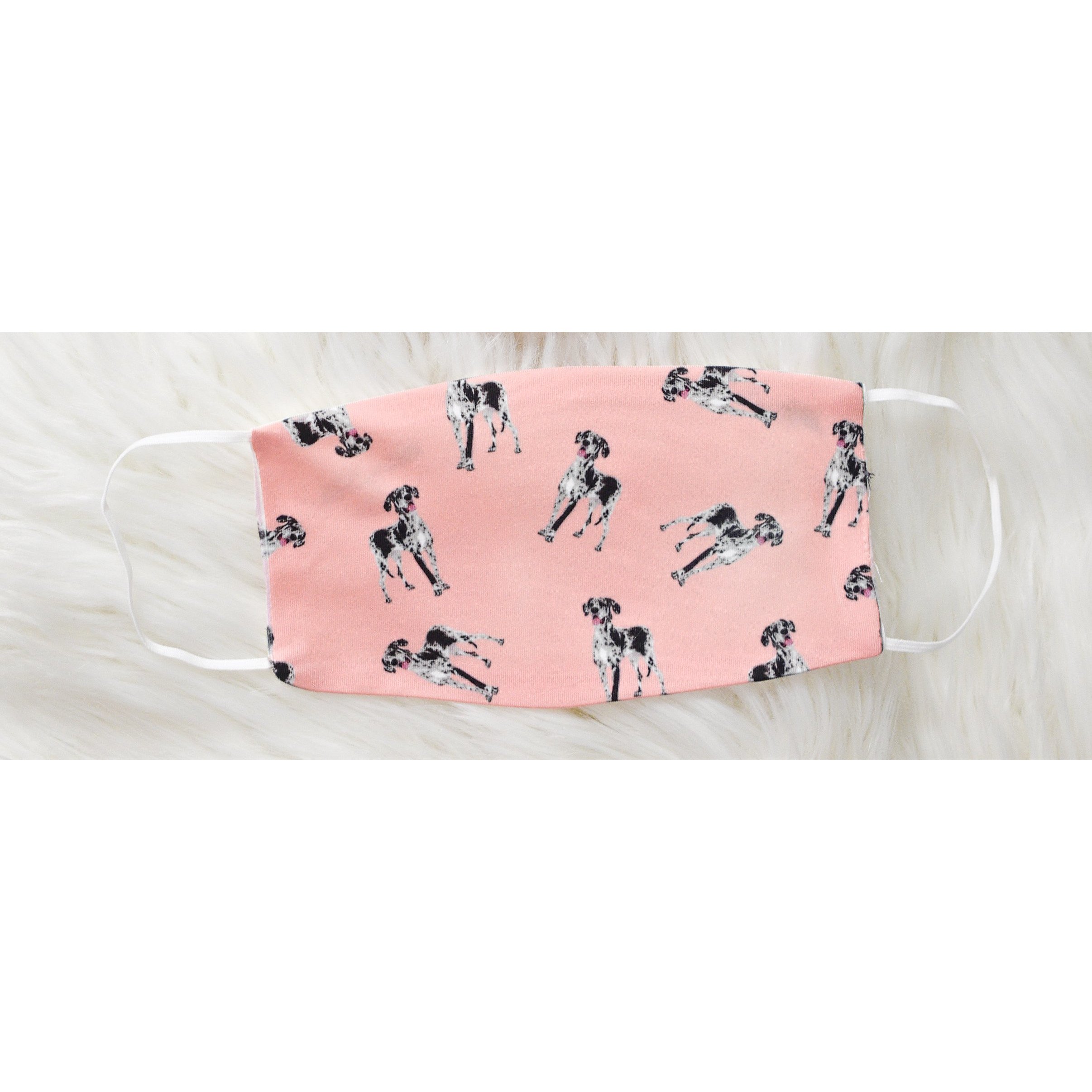 Handmade face coverings for kids, featuring soft polyester front and organic cotton interior, available in two sizes.