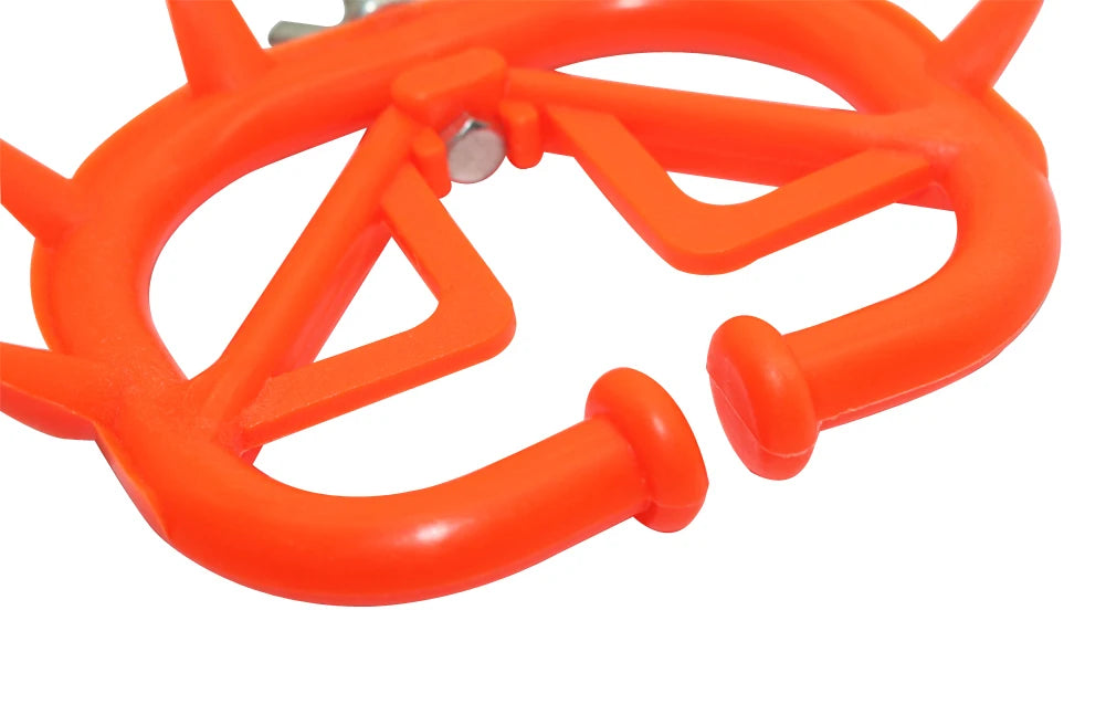 Red plastic calf weaner designed for effective cattle weaning, featuring puncturing thorns for discouraging nursing.