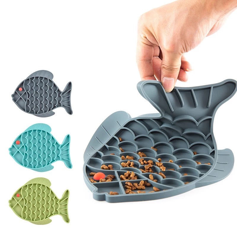 Fish shape silicone bowl designed for slow feeding and mental stimulation for small dogs and cats, featuring a no-slip base and rotating top.