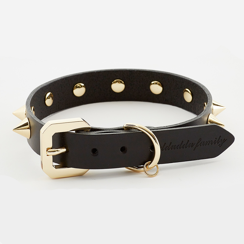 Golden Spike Black Collar made from thick vegetable-tanned leather with gold studs, showcasing its luxurious design and craftsmanship.