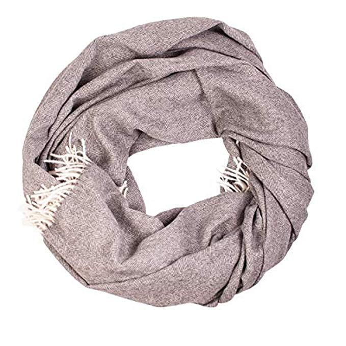 Luxurious 100% alpaca throw with herringbone pattern, showcasing its soft texture and elegant design.