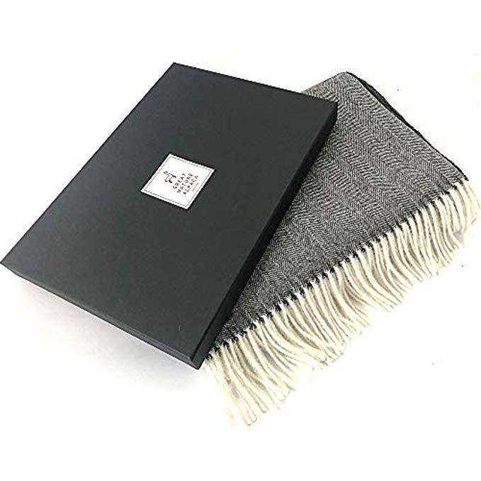 Luxurious 100% alpaca throw with herringbone pattern, showcasing its soft texture and elegant design.