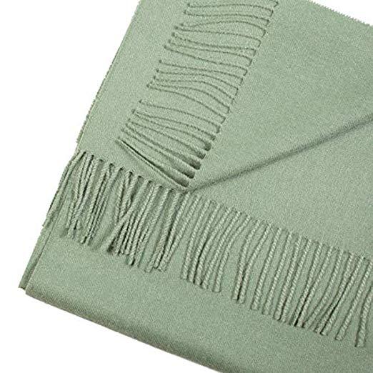 Luxurious green scarf made from 100% baby alpaca wool, showcasing its soft texture and elegant design.