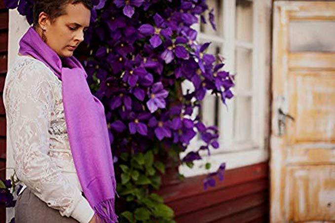 Luxurious purple scarf made from 100% baby alpaca wool, showcasing its soft texture and elegant design.