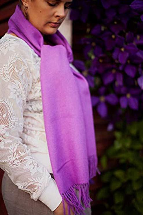 Luxurious purple scarf made from 100% baby alpaca wool, showcasing its soft texture and elegant design.