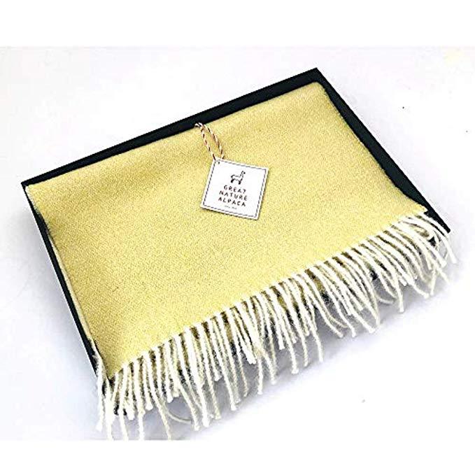 Luxurious yellow-white 100% baby alpaca scarf, showcasing its soft texture and elegant design, perfect for winter wear.
