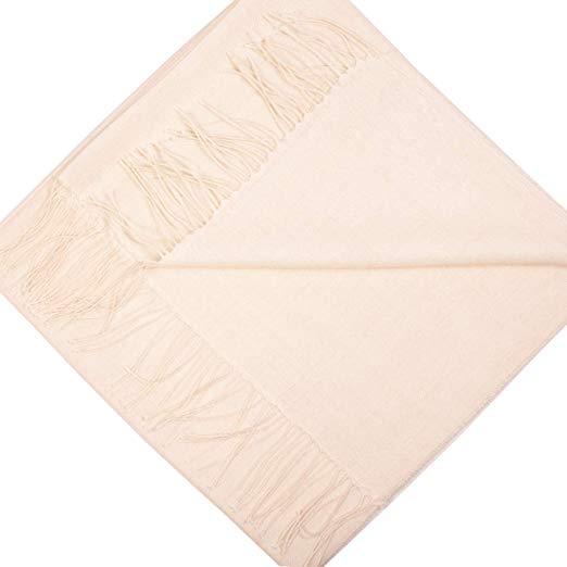 Luxurious white shawl made from 70% baby alpaca and 30% silk, showcasing its soft texture and elegant design.