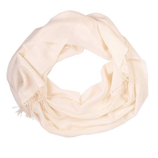 Luxurious white shawl made from 70% baby alpaca and 30% silk, showcasing its soft texture and elegant design.