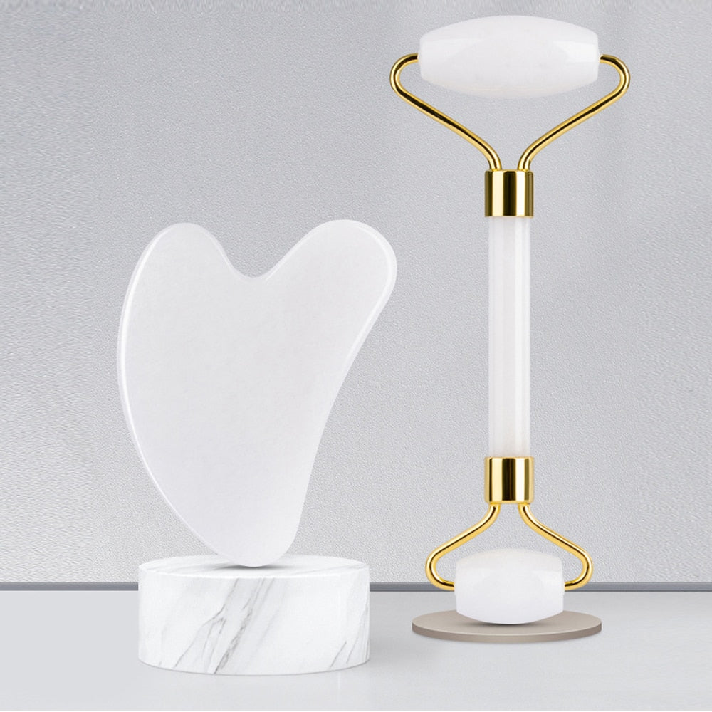 GuaSha Massage Roller Scraper made of natural rose quartz, designed for face lifting and body relaxation, showcasing its elegant pink color.