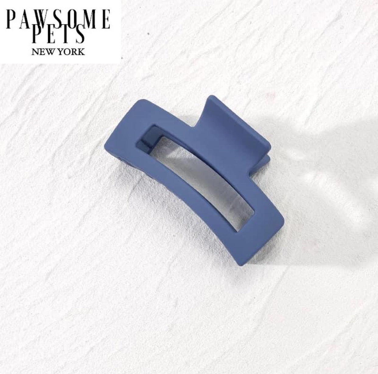 A pair of stylish blue hair claws designed for thick and long hair, showcasing their elegant design and secure grip.