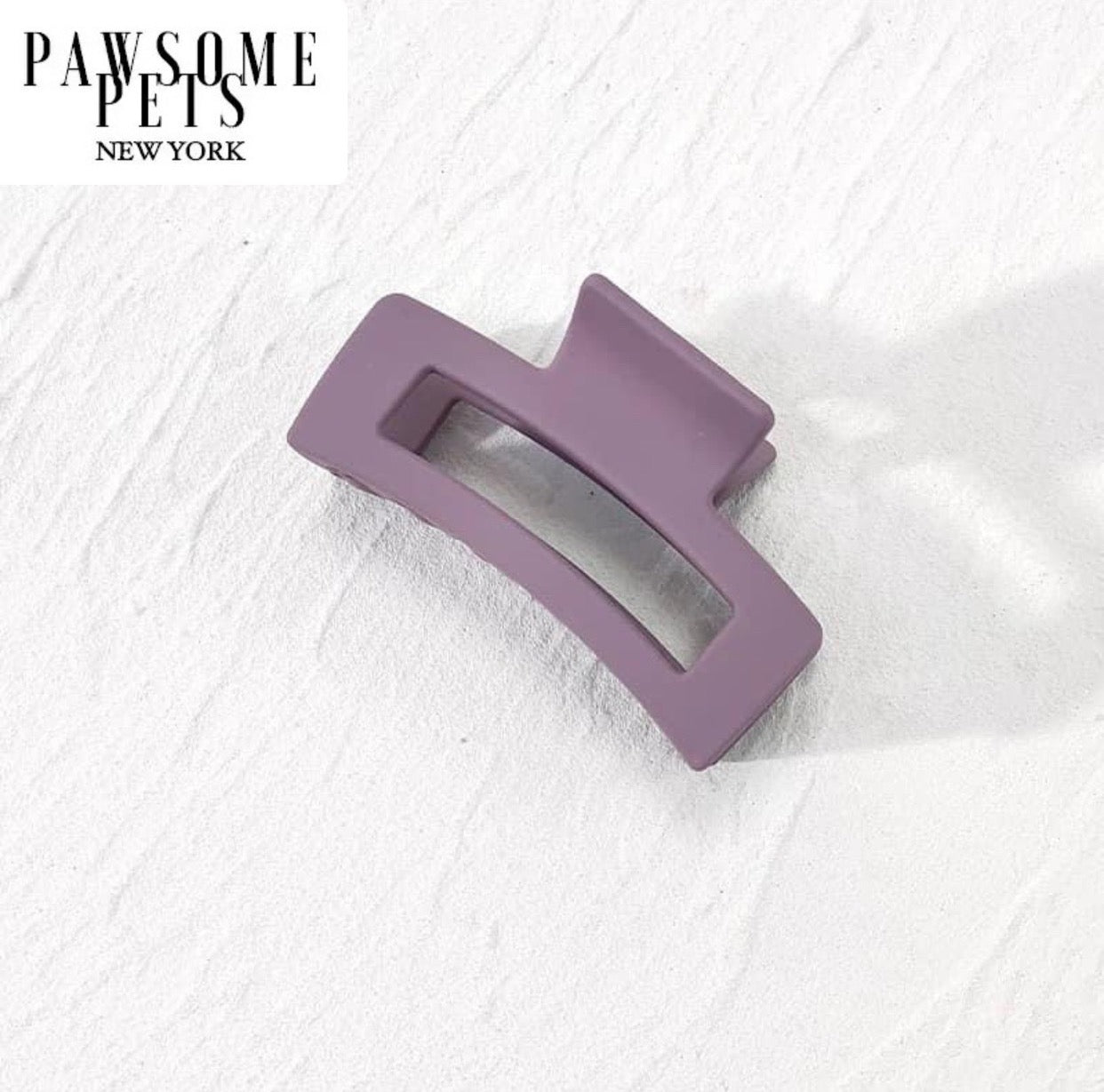 Purple hair claws designed for thick and long hair, showcasing a stylish and functional accessory for effortless hairstyles.