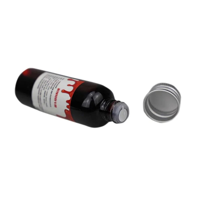 A bottle of ultra-realistic fake blood with a rich red color, perfect for Halloween costumes and special effects makeup.
