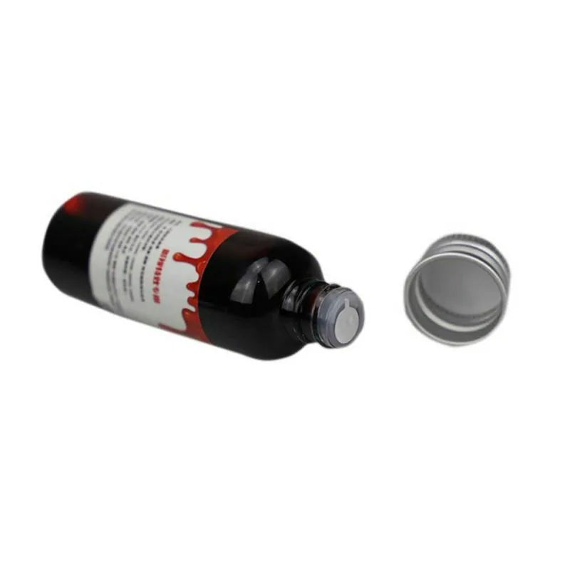 A bottle of ultra-realistic fake blood with a rich red color, perfect for Halloween costumes and special effects makeup.