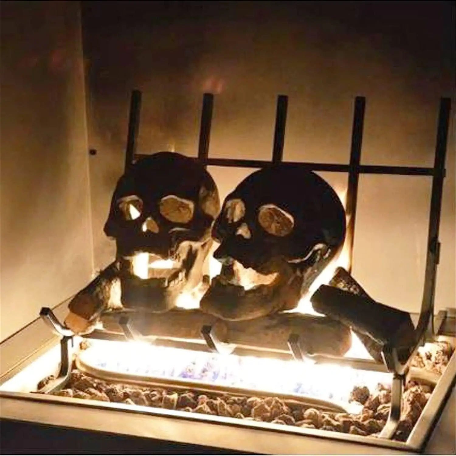 Ceramic Halloween fire pit skull with hollow eye sockets, flames dancing through its eyes, creating a spooky atmosphere.