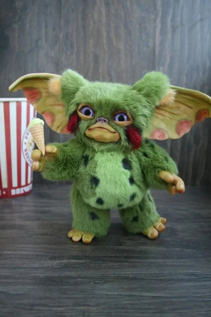 A handcrafted Halloween Mogwai Doll featuring realistic hair and eyes, inspired by the Gremlins character, perfect for spooky decor.