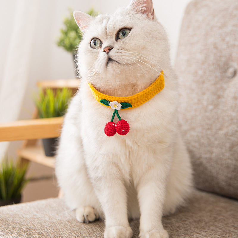 A collection of handmade cherry accessories for pets, featuring vibrant colors and unique designs.
