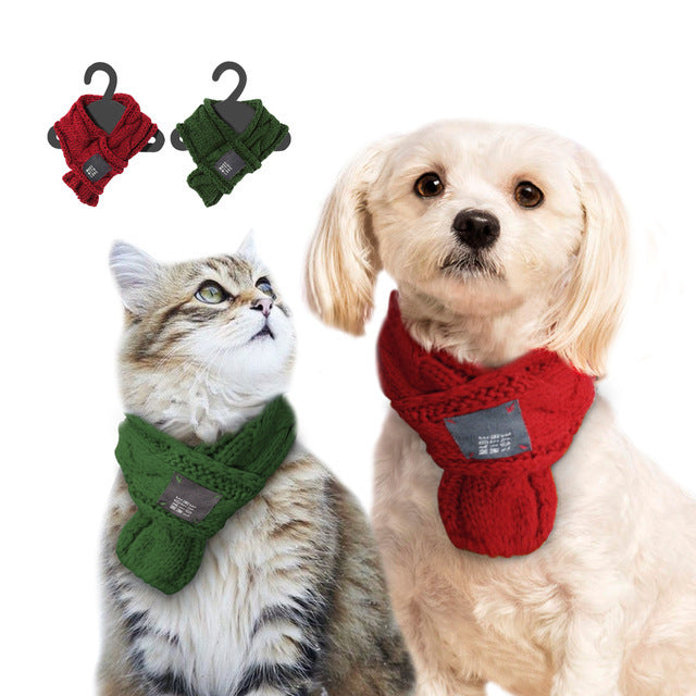 A festive handmade scarf designed for pets, featuring a cute Santa design with reindeer motifs, perfect for holiday celebrations.