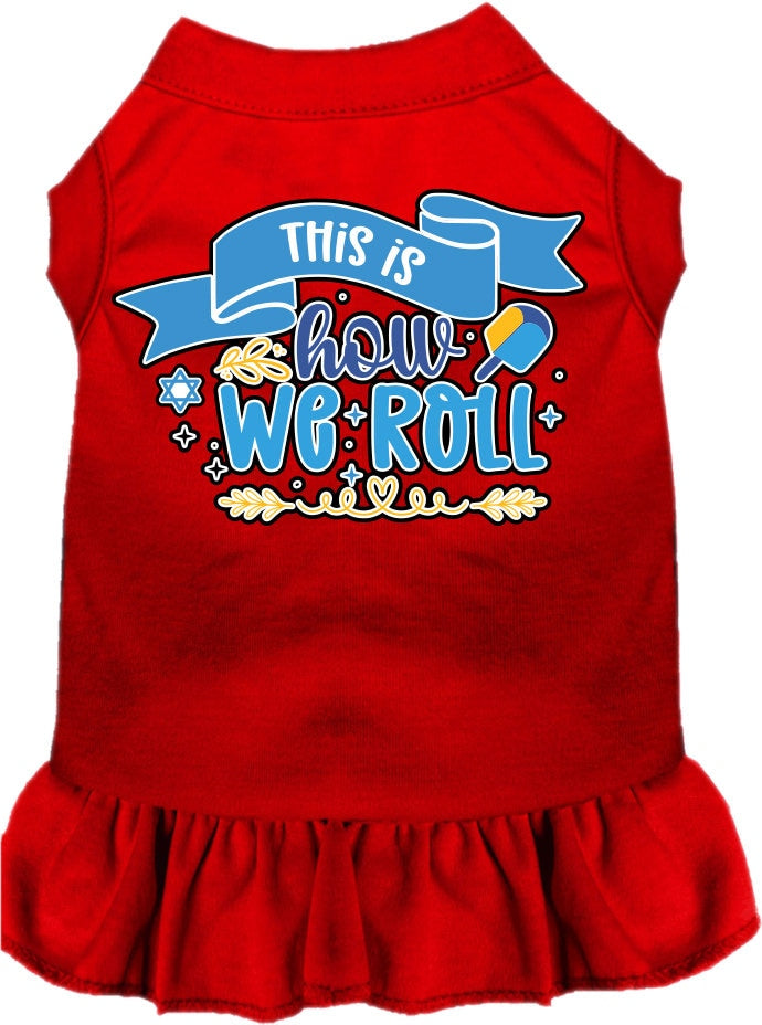 A cute Hanukkah-themed dress for dogs and cats, featuring a ruffled bottom and the phrase 'This Is How We Roll' printed on it.