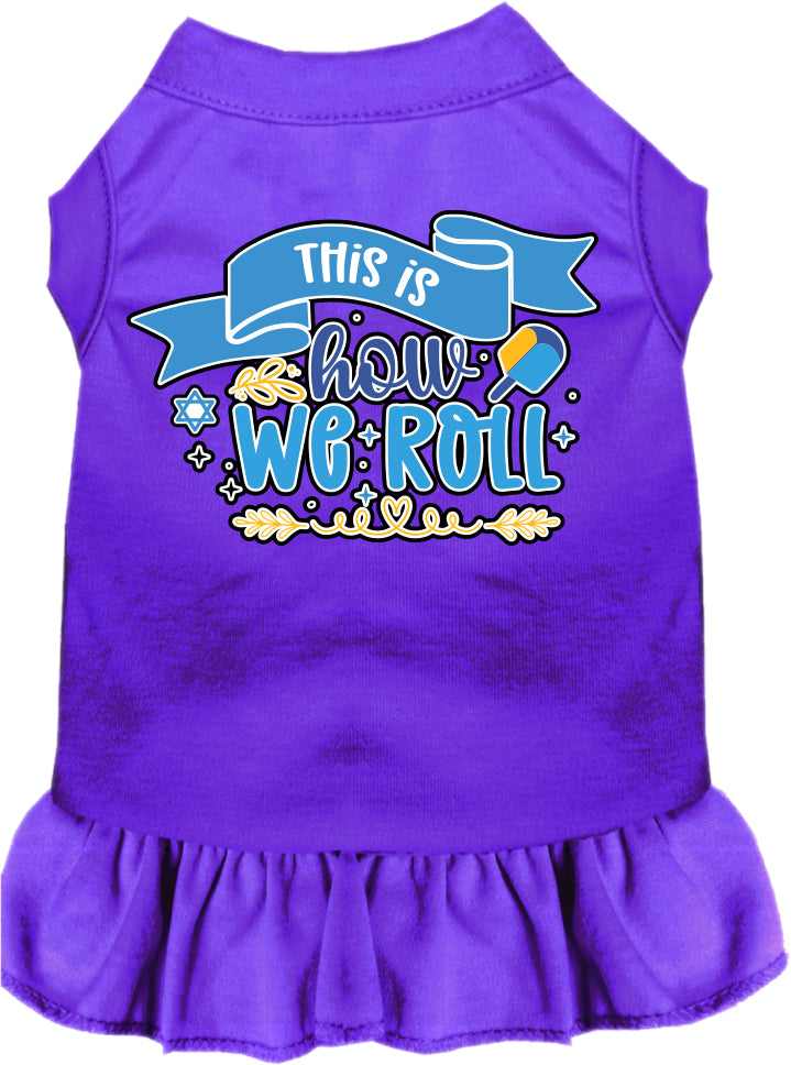 A cute Hanukkah-themed dress for dogs and cats, featuring a ruffled bottom and the phrase 'This Is How We Roll' printed on it.