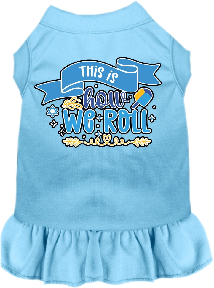 A cute Hanukkah-themed dress for dogs and cats, featuring a ruffled bottom and the phrase 'This Is How We Roll' printed on it.