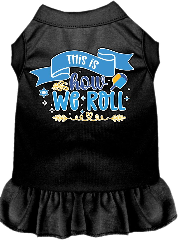 A cute Hanukkah-themed dress for dogs and cats, featuring a ruffled bottom and the phrase 'This Is How We Roll' printed on it.