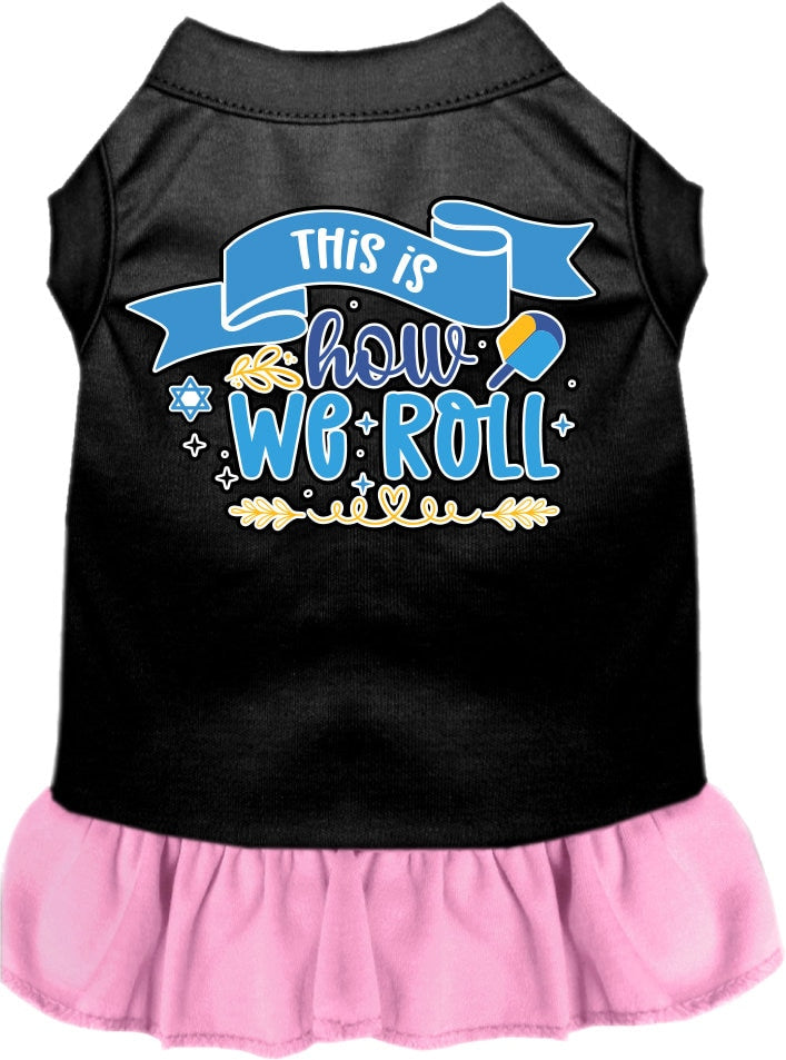 A cute Hanukkah-themed dress for dogs and cats, featuring a ruffled bottom and the phrase 'This Is How We Roll' printed on it.