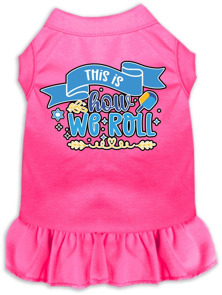 A cute Hanukkah-themed dress for dogs and cats, featuring a ruffled bottom and the phrase 'This Is How We Roll' printed on it.