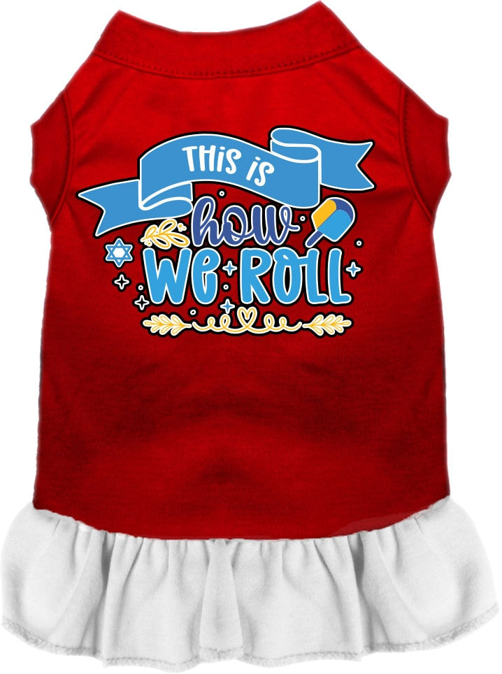 A cute Hanukkah-themed dress for dogs and cats, featuring a ruffled bottom and the phrase 'This Is How We Roll' printed on it.