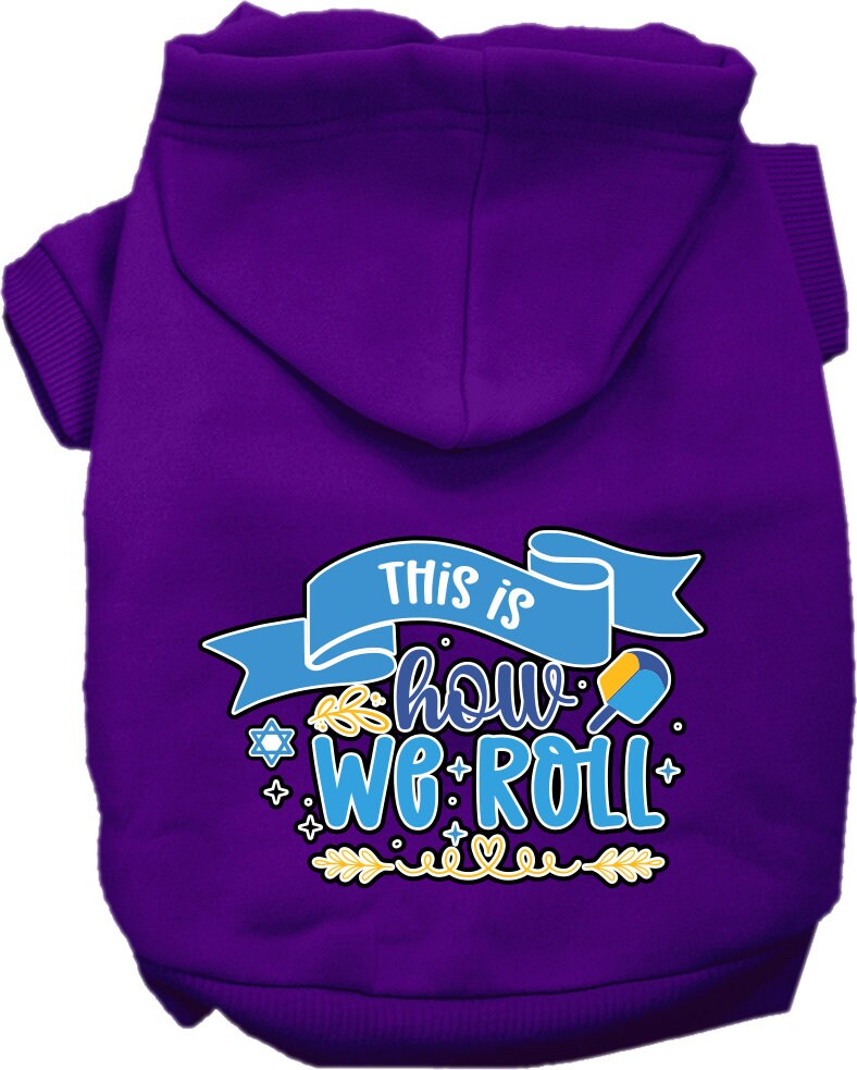 A cozy Hanukkah hoodie for dogs and cats, featuring the phrase 'This Is How We Roll' in festive colors, perfect for holiday celebrations.
