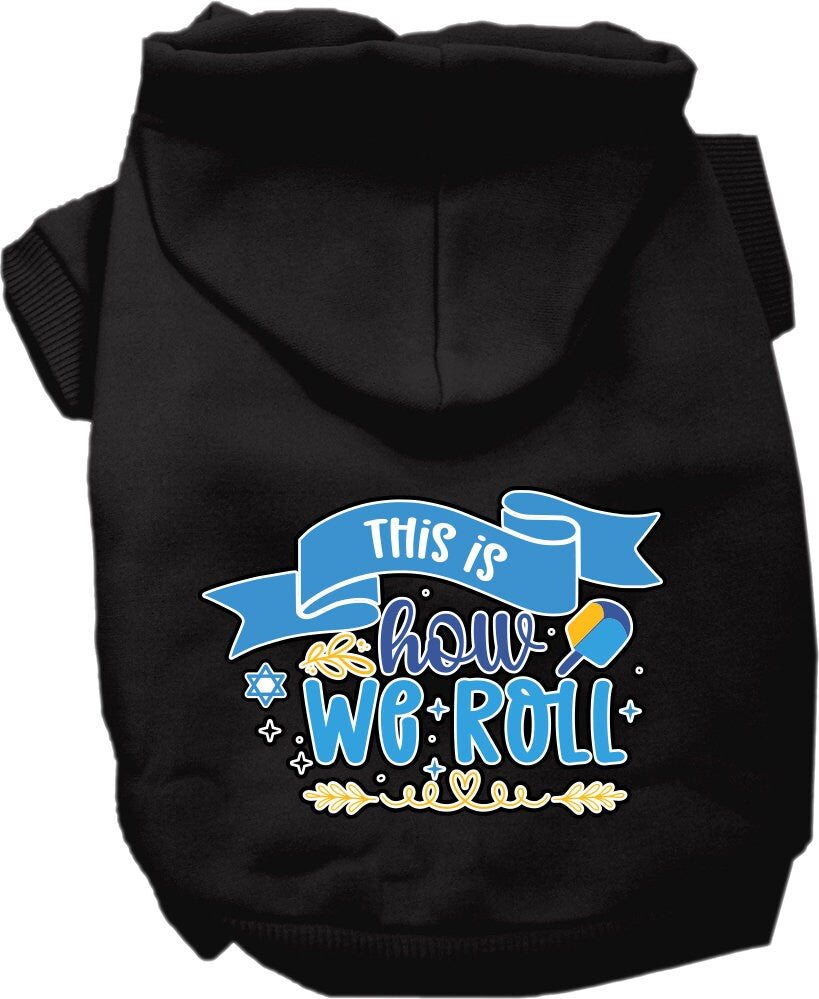 A cozy Hanukkah hoodie for dogs and cats, featuring the phrase 'This Is How We Roll' in festive colors, perfect for holiday celebrations.