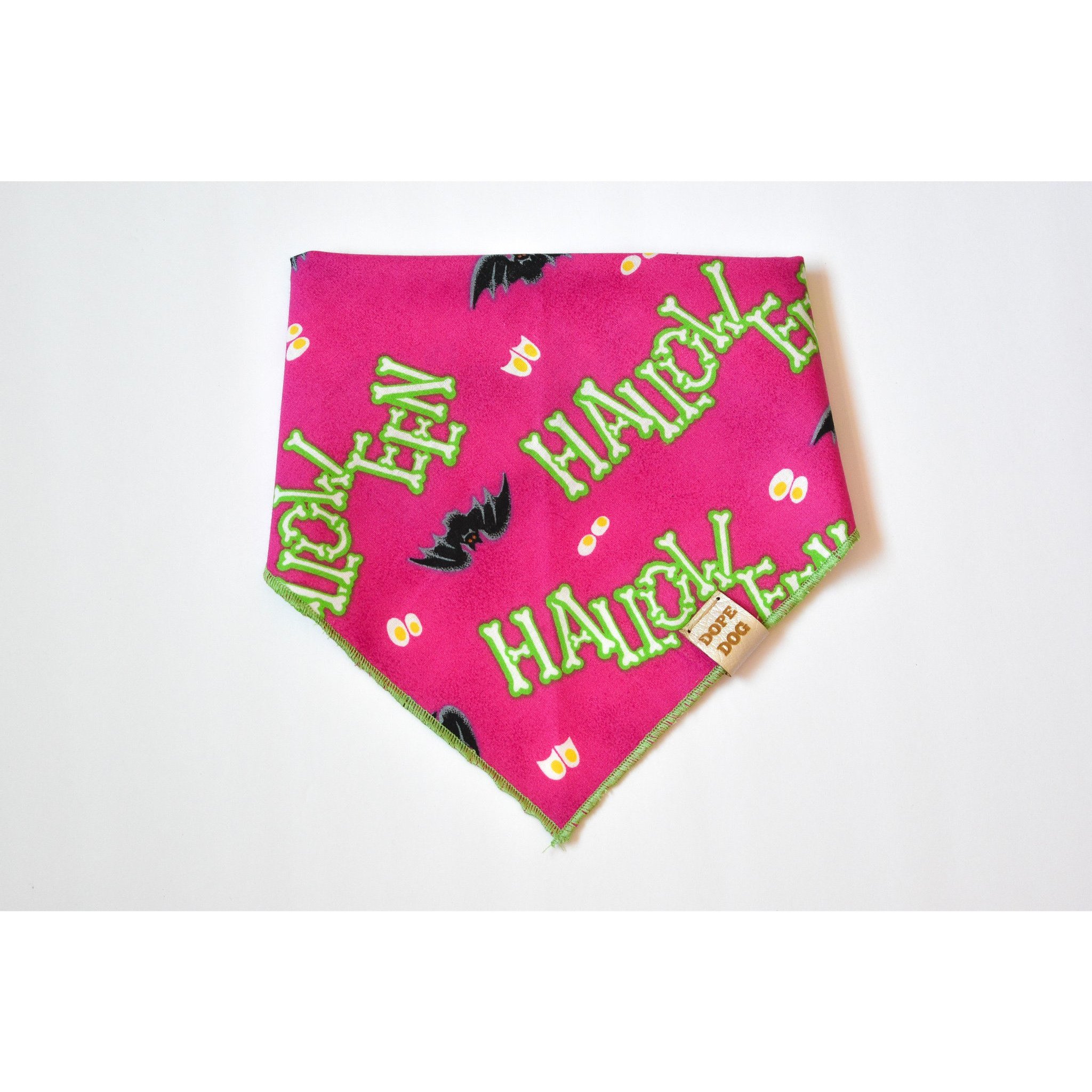 Happy Halloweenie dog bandana made of lightweight cotton fabric with a vegan leather dog tag, perfect for Halloween celebrations.
