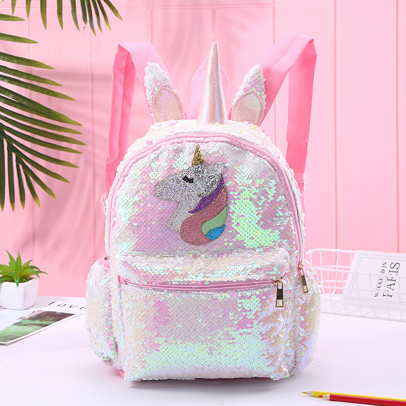 Colorful unicorn backpack with sequins, adjustable straps, and side pockets, made from recycled materials.