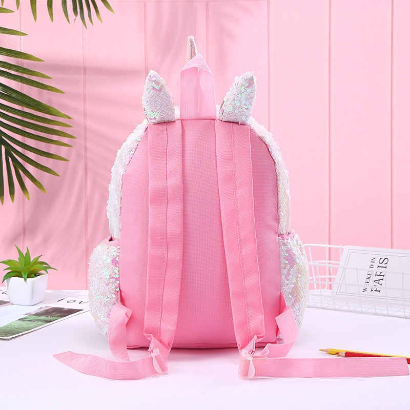 Colorful unicorn backpack with sequins, adjustable straps, and side pockets, made from recycled materials.