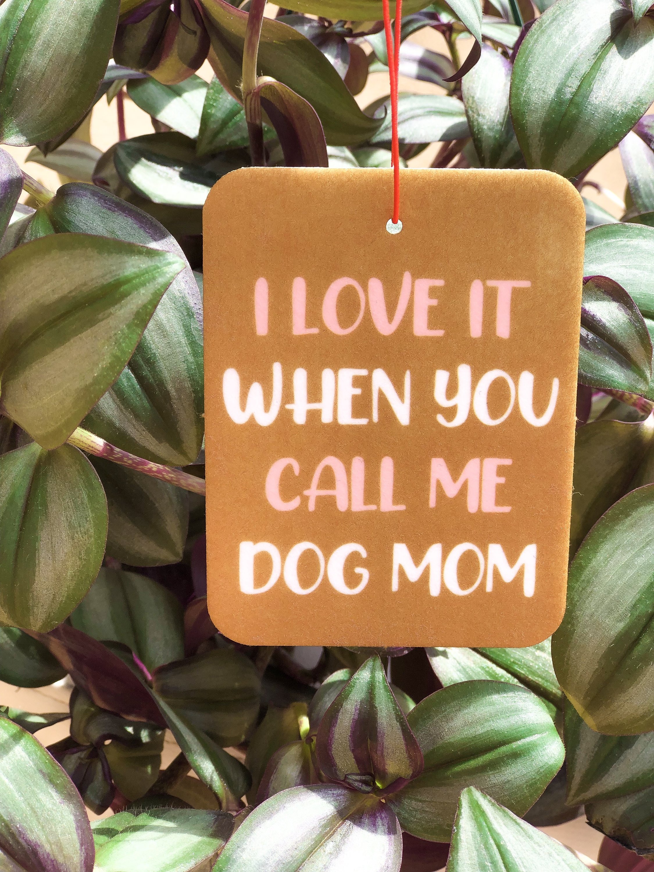 I Love It Air Freshener featuring a double-sided design for dog lovers, made from felt material, hanging from a rearview mirror.